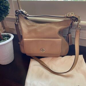 Medium sized beige leather Coach purse